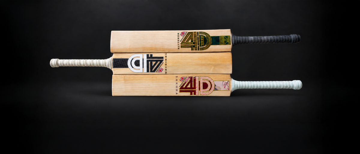 Three 4D Cricket bats on a dark background